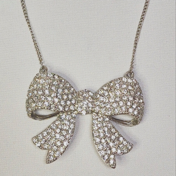 Fashion Forward Large Rhinestone and Silver Bow Pendant Necklace - Picture 10 of 11